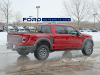 2021-ford-f-150-raptor-35-inch-tire-graphics-package-live-photos-010-rear-three-quarters-box-decals-raptor-script-fp-ford-performance-gn-generation-03-usa-flag