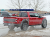 2021-ford-f-150-raptor-35-inch-tire-graphics-package-live-photos-011-rear-three-quarters-box-decals-raptor-script-fp-ford-performance-gn-generation-03-usa-flag-ford-script-on-tailgate