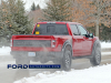 2021-ford-f-150-raptor-35-inch-tire-graphics-package-live-photos-013-rear-three-quarters-box-decals-raptor-script-fp-ford-performance-gn-generation-03-usa-flag-ford-script-on-tailgate