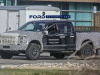 2021-ford-f-150-raptor-spy-shots-exterior-grille-001-hooking-up-trailer