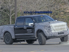 2021-ford-f-150-raptor-spy-shots-exterior-grille-003-towing-running-over-curb