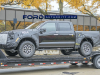 2021-ford-f-150-raptor-spy-shots-exterior-loaded-onto-flatbed-october-2020-001-front-three-quarters