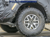 2021-ford-f-150-raptor-spy-shots-exterior-loaded-onto-flatbed-october-2020-006-rear-wheel-and-tire