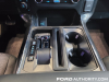 2022-ford-f150-xlt-sport-oxford-white-2022-nyias-interior-006-center-stack-usb-ports-center-console-stow-away-shifter-cup-holders