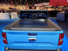 2022-ford-maverick-xlt-supercrew-awd-tucci-hot-rods-sema-2021-live-photos-exterior-007-rear-tonneau-bed-cover-spoiler-debossed-maverick-tailgate-blue-ford-badge