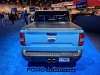 2022-ford-maverick-xlt-supercrew-awd-tucci-hot-rods-sema-2021-live-photos-exterior-008-rear-tonneau-bed-cover-spoiler-debossed-maverick-tailgate-blue-ford-badge-dual-center-exit-exhaust