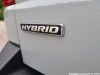 2022-ford-maverick-hybrid-cactus-gray-fa-garage-exterior-016-hybrid-badge-logo-tailgate