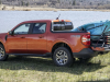 2022-ford-maverick-lariat-2l-ecoboost-awd-fx4-off-road-package-exterior-028-side-rear-three-quarters-kayak-in-bed