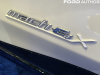 2022-ford-mustang-mach-e-ice-white-appearance-package-2022-nyias-live-photos-exterior-016-mach-e4x-logo-badge-on-front-door