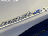 2022-ford-mustang-mach-e-ice-white-appearance-package-2022-nyias-live-photos-exterior-018-mach-e4x-logo-badge-on-front-door