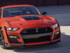 2022-ford-mustang-shelby-gt500-carbon-fiber-track-pack-code-orange-exterior-026-high-front-three-quarters-grille-shelby-snake-logo