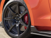 2022-ford-mustang-shelby-gt500-carbon-fiber-track-pack-code-orange-exterior-036-front-exposed-carbon-fiber-wheel-ford-logo-on-center-cap-red-brembo-brake-caliper-side-skirts
