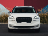2022-lincoln-aviator-jet-appearance-package-manufacturer-photos-exterior-002-pristine-white-front-headlamps-grille-lincoln-logo