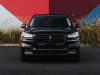 2022-lincoln-aviator-jet-appearance-package-manufacturer-photos-exterior-019-infinite-black-front-headlamps-grille-lincoln-logo