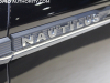 2022-lincoln-nautilus-reserve-awd-infinite-black-metallic-2022-chicago-auto-show-live-photos-exterior-012-nautilus-logo-badge-on-front-door