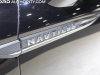 2022-lincoln-nautilus-reserve-awd-infinite-black-metallic-2022-chicago-auto-show-live-photos-exterior-013-nautilus-logo-badge-on-front-door