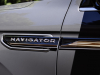 2022-lincoln-navigator-black-label-chroma-caviar-exterior-019-navigator-logo-script-on-front-fender-insert