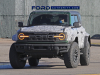 2022-ford-bronco-raptor-prototype-spy-shots-december-2021-exterior-003-front-ford-lettering-grille-headlights