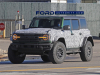 2022-ford-bronco-raptor-prototype-spy-shots-december-2021-exterior-005-front-three-quarters-ford-lettering-grille-headlights