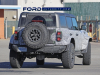 2022-ford-bronco-raptor-prototype-spy-shots-december-2021-exterior-014-side-rear-three-quarters-bf-goodrich-all-terrain-ta-tires-tail-lights-front-fender-vents