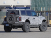2022-ford-bronco-raptor-prototype-spy-shots-december-2021-exterior-018-rear-bf-goodrich-all-terrain-ta-tires-tail-lights-front-fender-vents