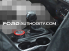 2023-ford-bronco-raptor-prototype-spy-shots-interior-004-center-console-shifter-with-red-accents-on-boot-drive-selector-with-red-accents