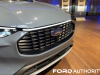 2023-ford-escape-phev-plug-in-hybrid-vapor-blue-live-photos-exterior-014-front-grille-ford-logo-badge