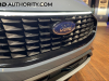 2023-ford-escape-phev-plug-in-hybrid-vapor-blue-live-photos-exterior-016-grille-ford-logo-badge