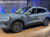 2023-ford-escape-phev-vapor-blue-k1-live-photos-exterior-005-side-front-three-quarters-plugged-in-charging