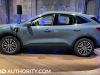 2023-ford-escape-phev-vapor-blue-k1-live-photos-exterior-006-side-plugged-in-charging