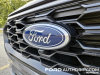 2023-ford-escape-st-line-elite-awd-hev-carbonized-gray-metallic-m7-fa-garage-review-exterior-011-ford-logo-badge-on-grille