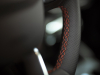 2023-ford-escape-st-line-elite-rapid-red-press-photos-interior-004-steering-wheel-stitching-detail