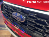 2023-ford-escape-st-line-rapid-red-live-photos-exterior-007-grille-ford-logo-badge