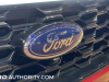 2023-ford-escape-st-line-rapid-red-live-photos-exterior-011-grille-ford-logo-badge-front-camera