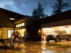 2022-ford-f-150-lightning-platinum-exterior-007-front-three-quarters-in-garage-after-storm