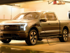 2022-ford-f-150-lightning-platinum-exterior-009-front-three-quarters-in-garage-after-storm