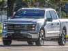 2022-ford-f-150-lightning-platinum-iconic-silver-first-on-the-road-photos-october-2021-exterior-001-front-three-quarters