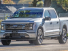2022-ford-f-150-lightning-platinum-iconic-silver-first-on-the-road-photos-october-2021-exterior-002-front-three-quarters