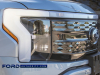 2022-ford-f-150-lightning-platinum-iconic-silver-first-on-the-road-photos-october-2021-exterior-017-front-end-headlight-light-bar-grille