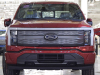 2022-ford-f-150-lightning-start-of-production-rouge-electric-vehicle-center-april-26-2022-033-lariat-charging-grille-ford-logo-headlights