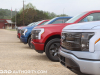2022-ford-f150-lightning-first-drive-lineup-exterior-014-platinum-iconic-silver-metallic-xlt-rapid-red-metallic-tinted-clearcoat-lariat-antimatter-blue-metallic