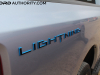 2022-ford-f150-lightning-platinum-first-drive-exterior-011-lightning-logo-badge