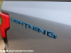 2022-ford-f150-lightning-platinum-first-drive-exterior-014-lightning-logo-badge