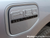 2022-ford-f150-lightning-platinum-first-drive-exterior-019-charge-port-cover-f150-logo-badge