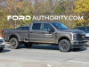 2023-ford-f-250-super-duty-super-crew-8-foot-bed-xl-with-stx-appearance-package-stone-gray-metallic-d1-first-photos-exterior-004