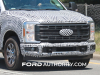 2023-ford-f-250-super-duty-xlt-prototype-spy-shots-july-2022-exterior-015-front-end-grille-headlights-tow-hooks-fog-lights