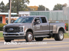 2023-ford-f-450-super-duty-crew-cab-8-foot-long-bed-lariat-stone-gray-metallic-d1-missing-chrome-accents-exterior-002