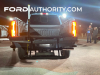 2023-ford-f-series-super-duty-f-250-lariat-azure-gray-reveal-event-october-2022-exterior-008-rear-tail-lights-on-brake-lights-on-integrated-tail-gate-step-ladder-extending-grab-handle