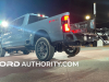 2023-ford-f-series-super-duty-f-250-lariat-azure-gray-reveal-event-october-2022-exterior-010-rear-three-quarters-tail-lights-on-rear-bumper-step-integrated-tail-gate-step-ladder-extending-grab-handle