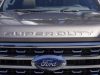 2023-ford-super-duty-f-350-drw-dually-lariat-press-photos-exterior-003-front-hood-superduty-script-grille-ford-logo-badge